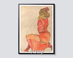 Egon Schiele Femme à genoux en robe orange-rouge, portrait expressionniste sur mur