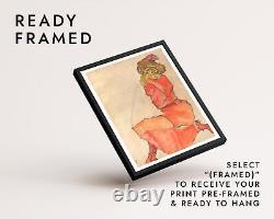 Egon Schiele Femme à genoux en robe orange-rouge, portrait expressionniste sur mur